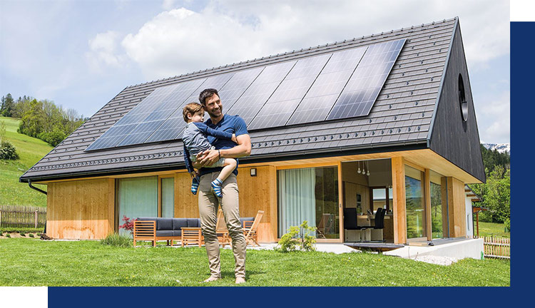 father and son standing in front of there home with a full solar panel system install