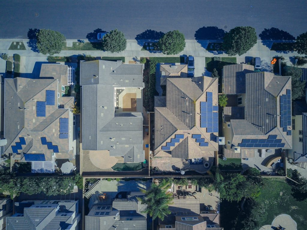 areal view of a New York residential neighborhood with multiple solar installs