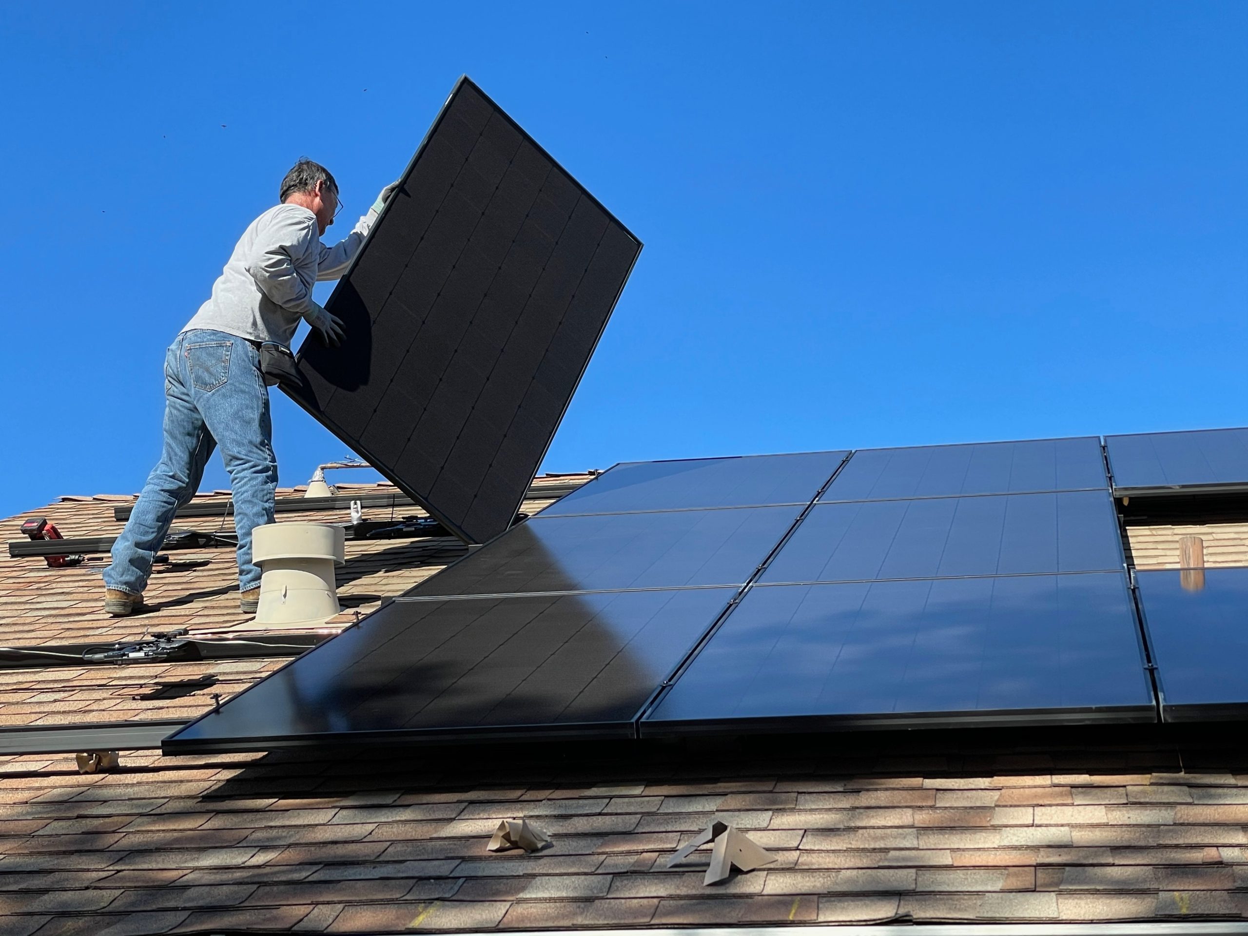 solar installer Installing Solar Panels on a roof